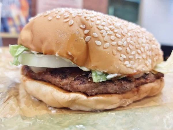 stock image A Hamburger Sandwich Bun Onion Lettuce