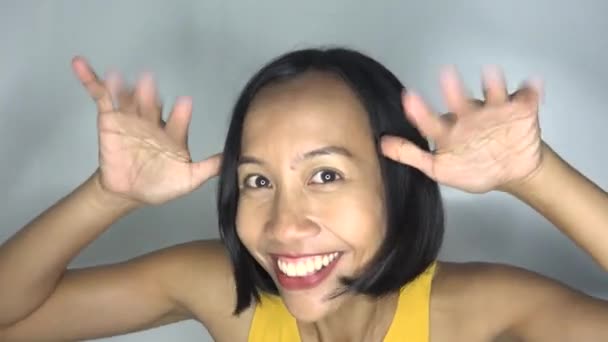 Goofy Asian Woman Making Funny Faces — Vídeos de Stock