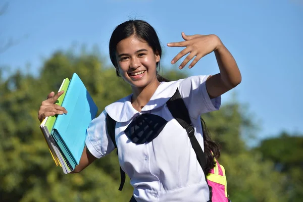 Happy Pretty Minority Girl Student Wearing School Uniform With Textbooks