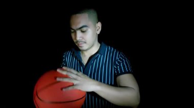 An Asian Man Holding Basketball Isolated
