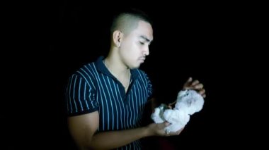 Sad Asian Man With Teddy Bear