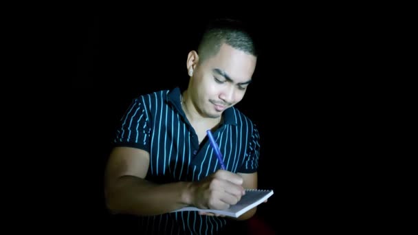 Asian Man Writing Notebook — Stock Video