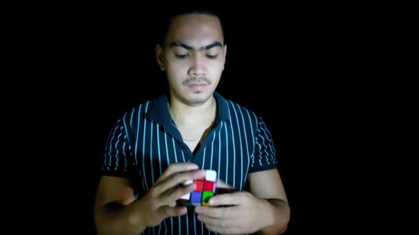 Asian Man Using Logic Puzzle Game — Stock Video
