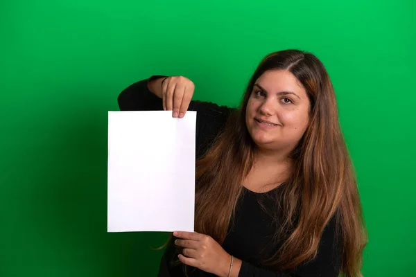 stock image Young woman holding a empty white paper,   Green Background is easy to change to any colour