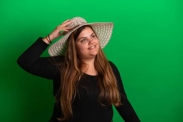 stock image Young woman wearing a summer hat,   Green Background is easy to change to any colour