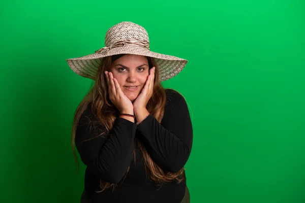 stock image Young woman wearing a summer hat,   Green Background is easy to change to any colour