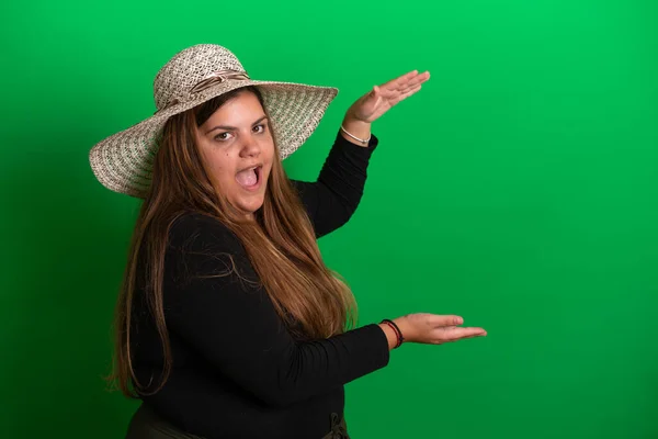 stock image Young woman wearing a summer hat,   Green Background is easy to change to any colour