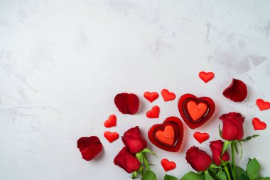 Happy Valentine's day  background with heart shape candle and rose flowers. Top view, flat lay