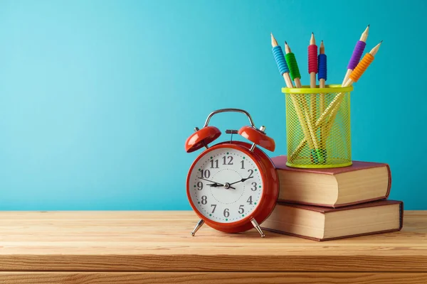 Volver Escuela Con Lápices Libros Reloj Despertador Sobre Mesa Madera —  Fotos de Stock