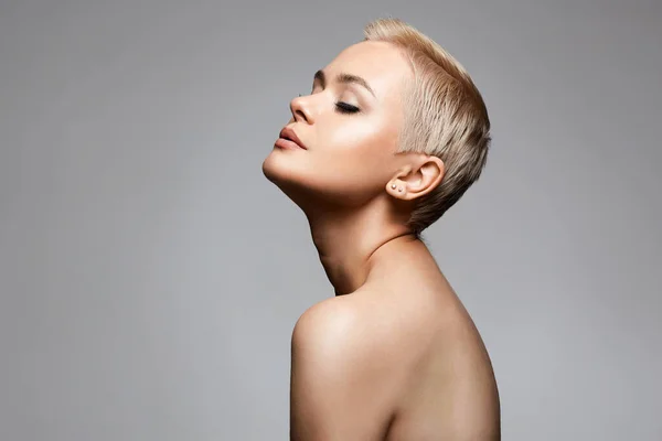 Short Hair Beautiful young woman. sensual girl with blond Hair. Bald Hair style