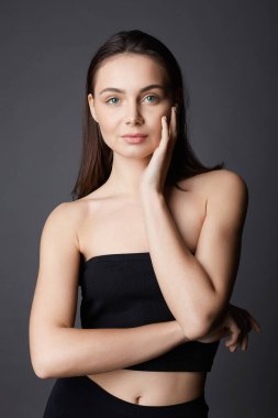 beautiful young woman without Make-up. studio portrait of pretty brunette model girl