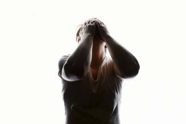 Sad Man silhouette over white background. Emotion boy. Crying