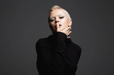 portrait of Short Hair Beautiful young woman with white snow brows. sensual blond girl with fancy makeup. Bald style