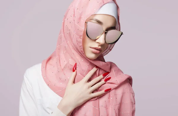 beautiful islamic young woman with long Nails. beauty girl in hijab and sunglasses. fashion oriental model. Asian face