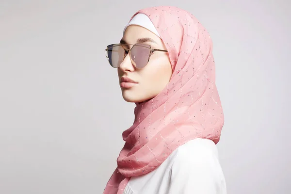 beautiful islamic style young woman. beauty girl in hijab and sunglasses. fashion oriental model. Asian face