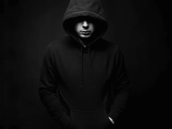 Person in Hood. Man or Boy in a hooded sweatshirt. Black and white portrait