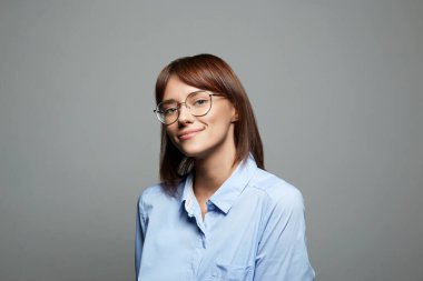 Smiling Happy Girl in glasses. Beautiful laughing Woman. Photo of pretty businesslike woman wearing eyeglasses