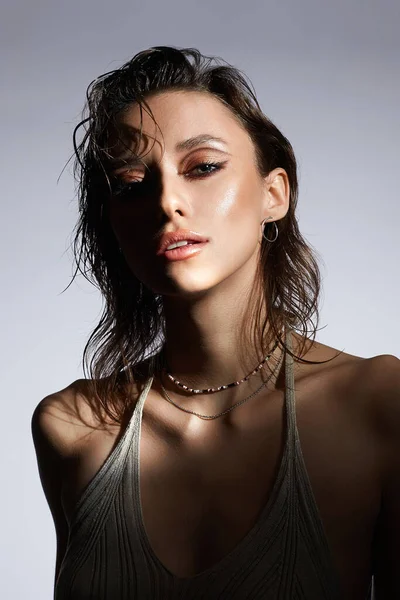beautiful girl with wet hair. pretty young sexy woman fashion portrait