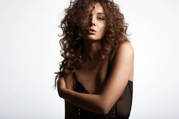 beautiful young woman with curly hair. beauty portrait of healthy hair pretty sexual girl in undewear