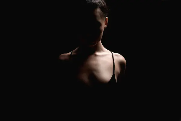 stock image Sexy Woman in the dark. Beautiful silhouette of Girl over black background