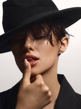 close-up portrait of Beautiful passion young woman in hat. sexy lady with wet hair