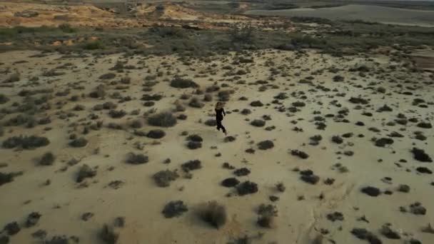 Aerial Drone Shot Girl Black Suit Walking Running Bardenas Reales — Vídeo de stock