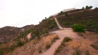 FPV Flight above beautifies castle on the top of San lucar de Guadiana hillock, Spain . High quality 4k footage