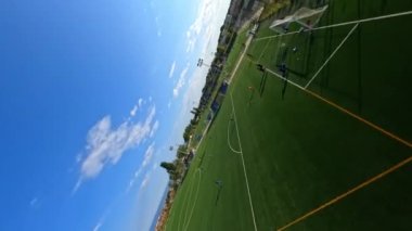 Dynamic fpv shot cruising around Lapoma bike park and above football field. Catalonia, extreme Dirt park in Premia de Dalt. Spain, 9 January 2023. High quality 4k footage