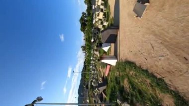 vertical fpv view flying above trees in Premia de Dalt area and Lapoma bike park, extreme Dirt park in Premia de Dalt. Spain, 9 January 2023. High quality 4k footage