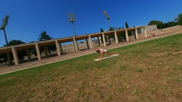 Dynamic Fpv Drone Shot Flying Girl White Dress Doing Stretching — Stockvideo