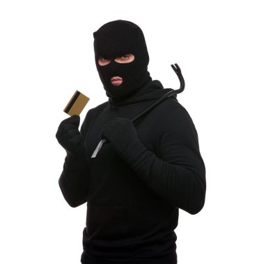 Thief in mask with crowbar and credit card on white background