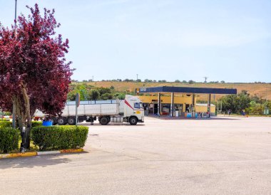 Caceres, Spain - May 2022. Service station for automobile surrounded by mountains in a sunny day