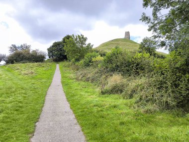 Tower of tor in Glastonbury in a cloudy day clipart