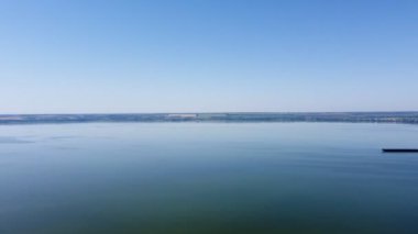 All-round panorama over the river from a drone height, from a bird's eye view. Drone footage of the river and islands on the river. Flight over the river, an island in the river.