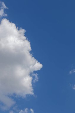 Human head side profile in the clouds clipart