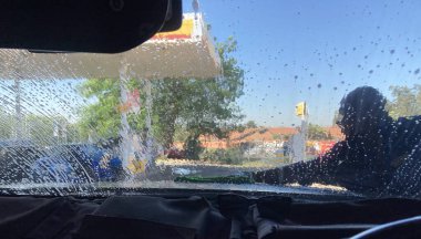 Johannesburg, South Africa - view from inside the vehicle while at the local car wash station at a Shell service station clipart