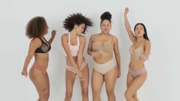 Static Shot Multiracial Female Models Underwear Smiling Dancing Together Gray — Stock Video