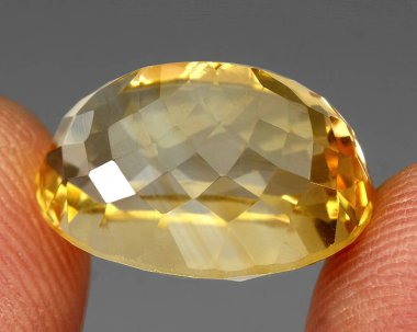 Natural gem yellow citrine on gray background