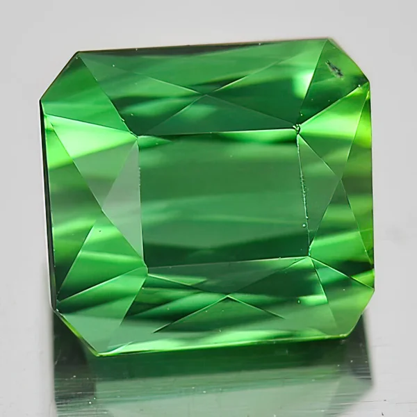 Natural gem green tourmaline on white background