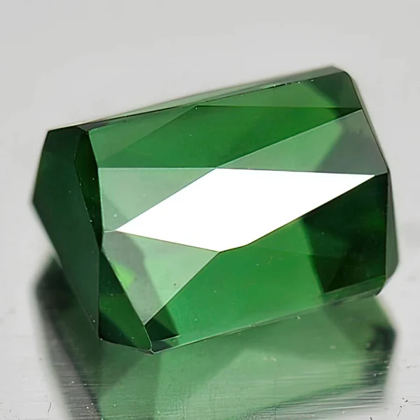 Natural gem green tourmaline on white background