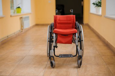 Children's wheelchair. Empty wheelchair in the hospital