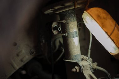 Replacement and repair of wheels and shock absorbers on a car