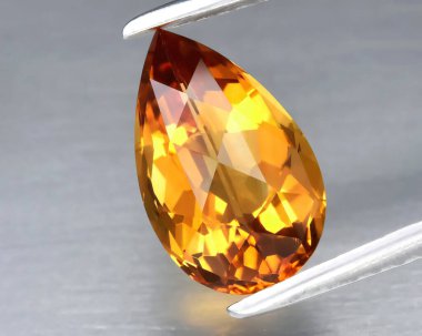 Natural gem yellow citrine on gray background