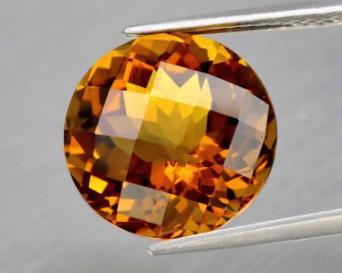 Natural gem yellow citrine on gray background