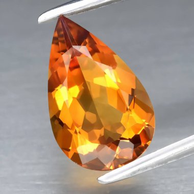 Natural gem yellow citrine on gray background