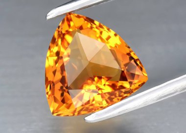 Natural gem yellow citrine on gray background