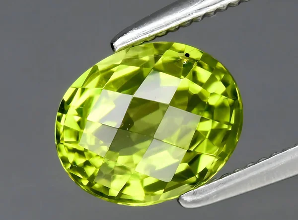 natural green peridot gem on background