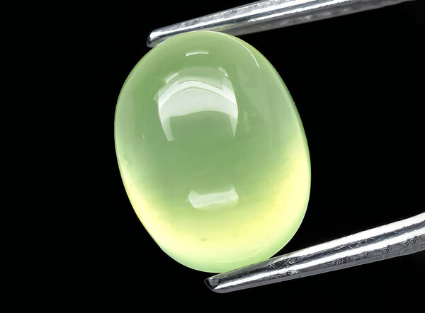 natural green prehnite gem on background