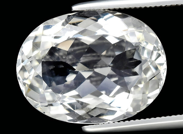 natural white topaz gem on background