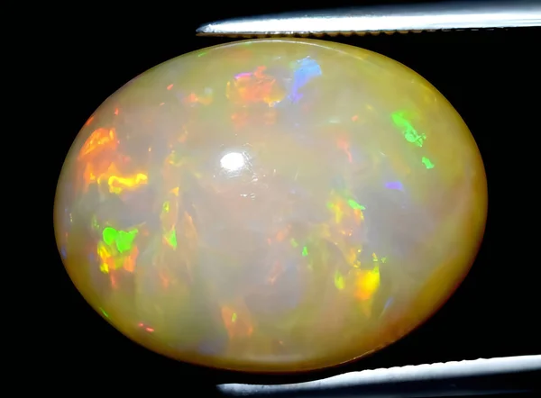 stock image natural rainbow multicolor opal gem on background